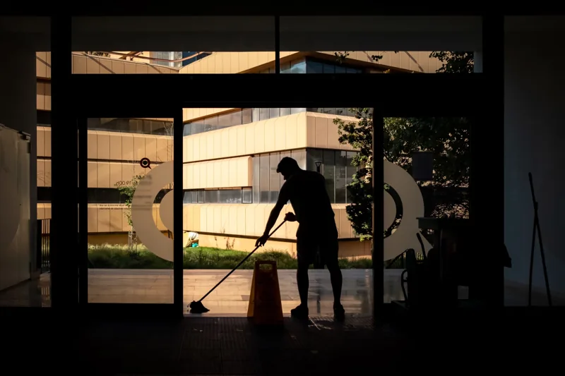 A cleaner caring for a modern office floor.